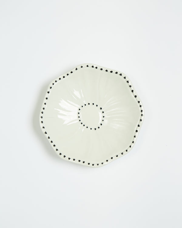 The small plate with the white poppy