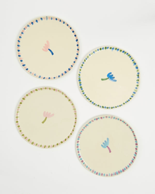 Set of four flower portrait plates